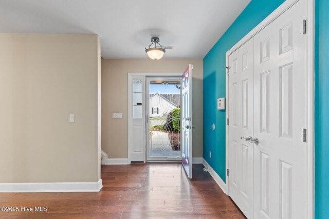 8525 Primm Forest Dr, Leland, NC 28451 - foyer with wood finished floors, baseboards, ceiling fan, and a glass covered fireplace