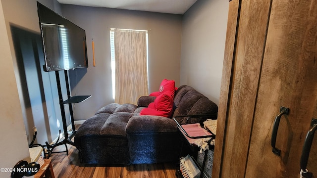 living area with hardwood / wood-style floors