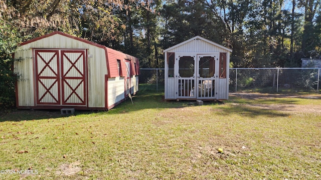 view of outdoor structure featuring a lawn