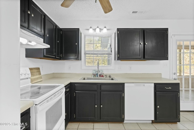 kitchen with white appliances, a textured ceiling, sink, ceiling fan, and light tile patterned floors