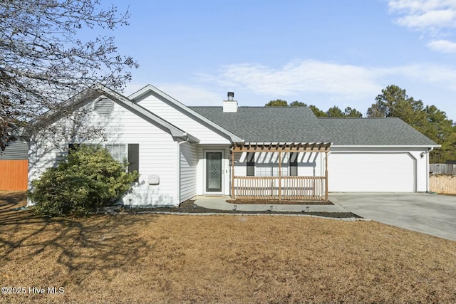 view of front of property featuring a front yard and a garage