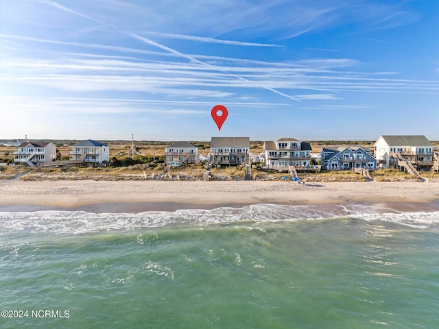 aerial view featuring a water view and a beach view