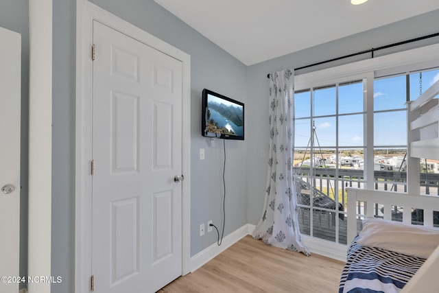 bedroom with light wood-type flooring