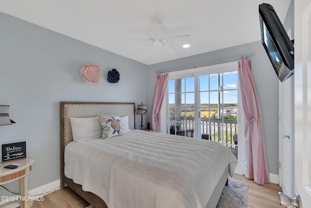 bedroom featuring access to outside, light wood-type flooring, and ceiling fan