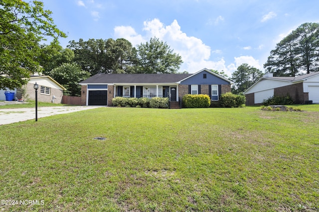 ranch-style house with a front yard and a garage