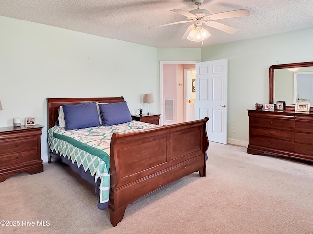 1324 Final Landing Ln, Wilmington, NC 28411 - bedroom featuring light carpet, a textured ceiling, and ceiling fan