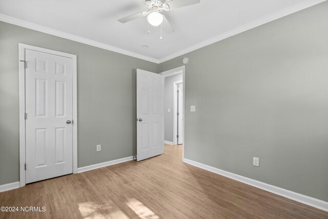 510 Millhouse Rd, Castle Hayne, NC 28429 - unfurnished bedroom with wood finished floors, baseboards, a ceiling fan, and ornamental molding