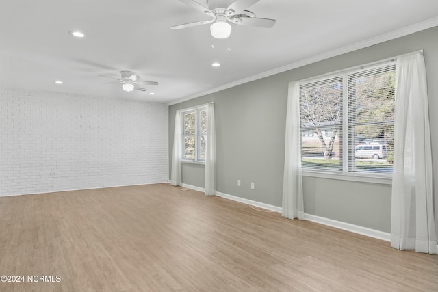 510 Millhouse Rd, Castle Hayne, NC 28429 - spare room with ornamental molding, light wood finished floors, brick wall, and ceiling fan