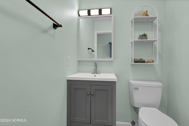 1928 New River Inlet Rd Unit 207, North Topsail Beach, NC 28460 - bathroom with toilet, vanity, and baseboards