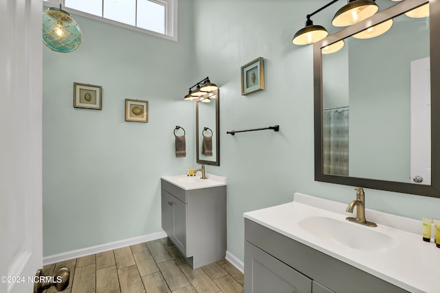 bathroom with vanity and wood-type flooring