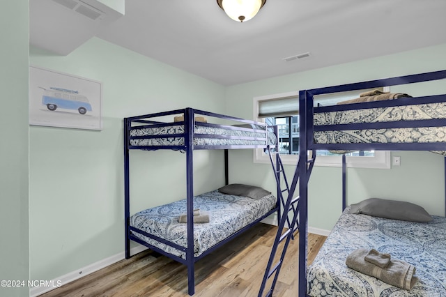 1928 New River Inlet Rd Unit 207, North Topsail Beach, NC 28460 - bedroom featuring wood finished floors and baseboards