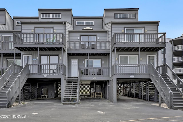 1928 New River Inlet Rd Unit 207, North Topsail Beach, NC 28460 - back of property featuring stairway and a carport