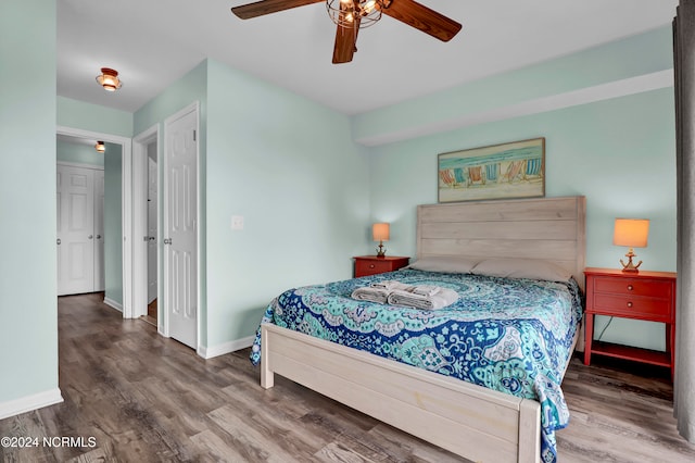 bedroom with wood-type flooring and ceiling fan