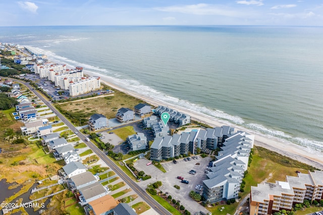 aerial view featuring a water view and a beach view