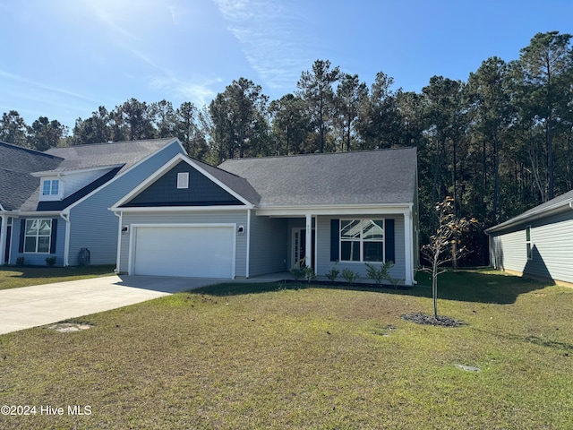 view of front of house with a front yard and a garage