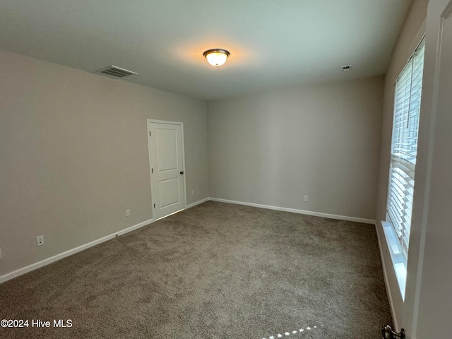 view of carpeted spare room