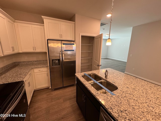 kitchen featuring white cabinets, sink, dark hardwood / wood-style floors, and stainless steel refrigerator with ice dispenser