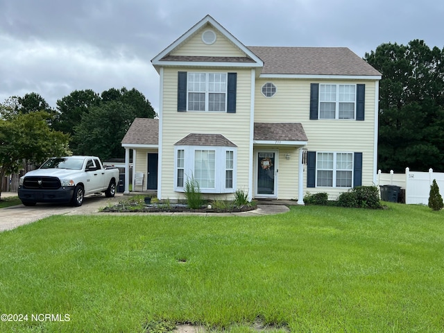 view of front of home featuring a front yard