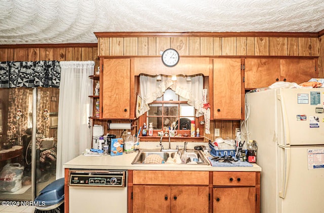 kitchen featuring sink, dishwasher, and white refrigerator