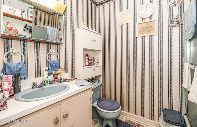 bathroom with vanity and toilet