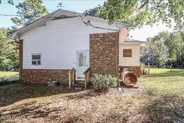 view of home's exterior with a lawn