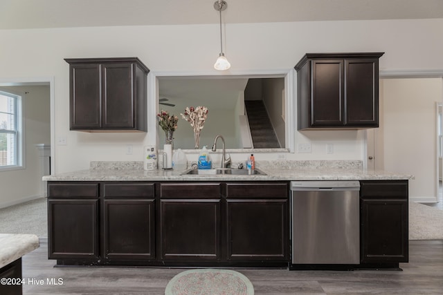 kitchen featuring dark brown cabinets, sink, pendant lighting, and dishwasher