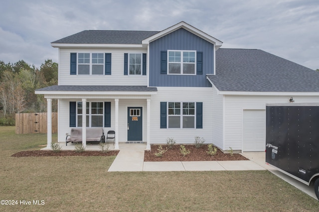 front facade featuring a garage and a front yard