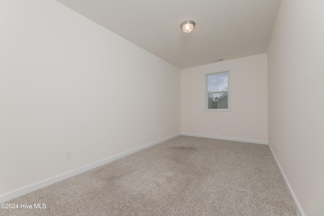 unfurnished room with carpet