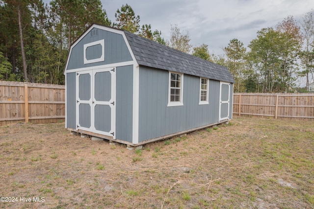 view of outbuilding with a yard