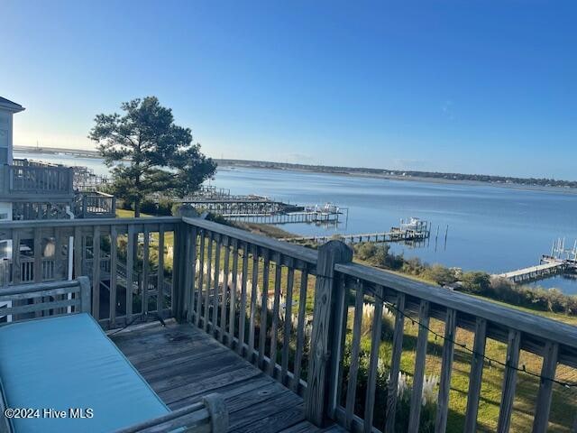 wooden deck with a water view