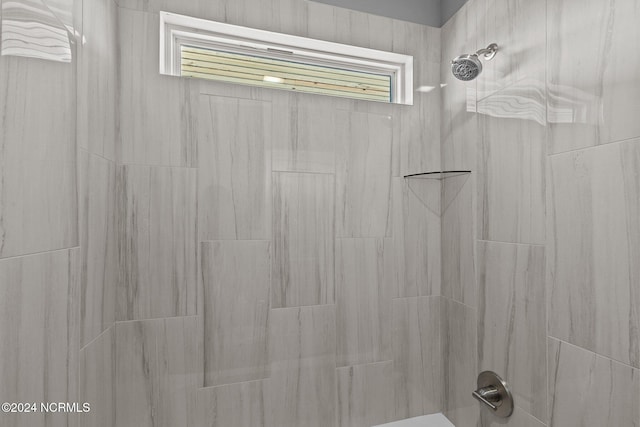 details with a tile shower