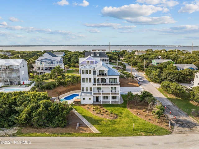 birds eye view of property with a water view