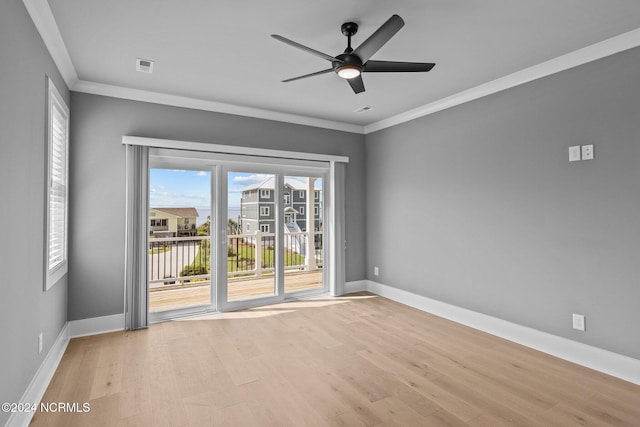 empty room featuring light hardwood / wood-style floors, ceiling fan, and ornamental molding