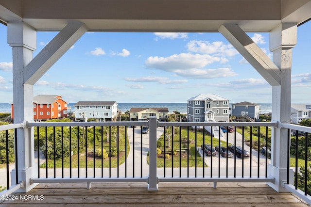 wooden terrace with a water view