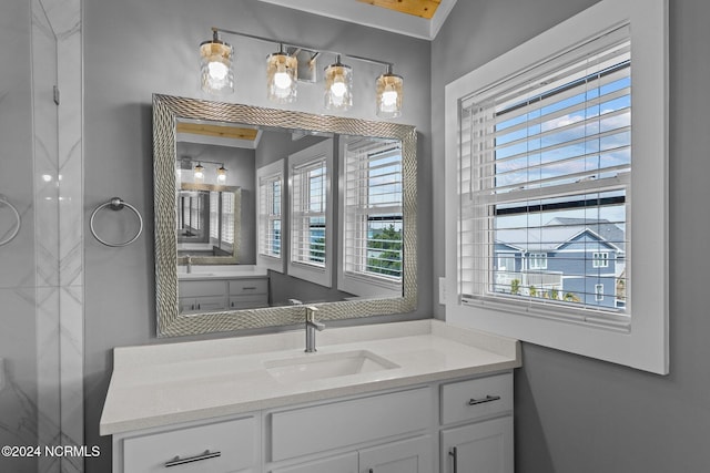 bathroom with plenty of natural light and vanity