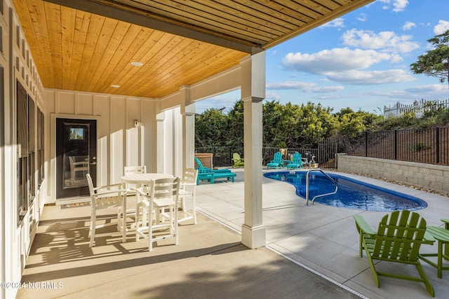 view of swimming pool featuring a patio area