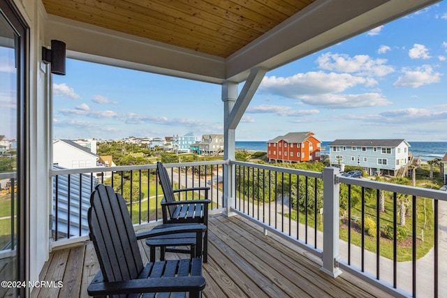 wooden terrace with a water view