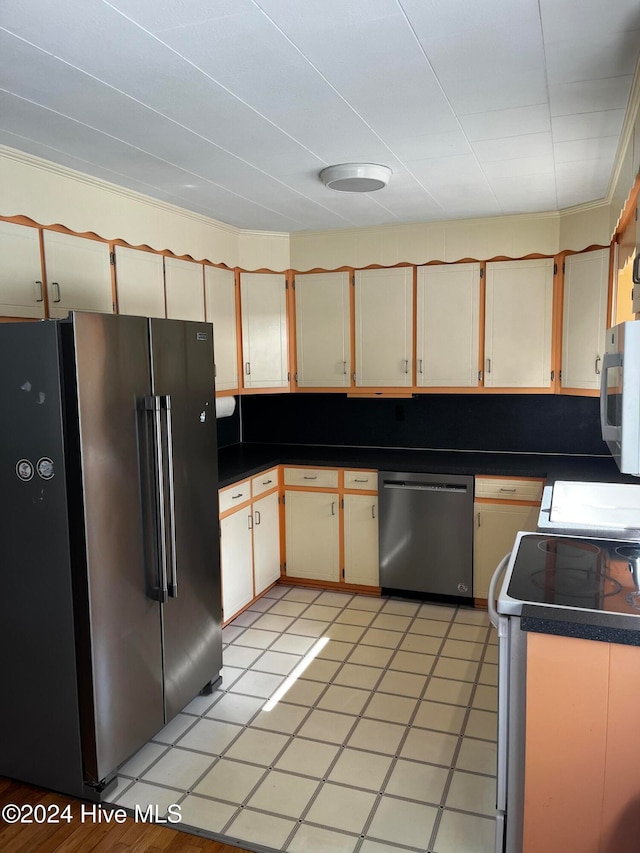 kitchen featuring appliances with stainless steel finishes and ornamental molding