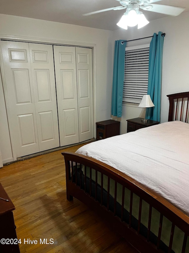 bedroom featuring a closet, ceiling fan, and dark hardwood / wood-style flooring