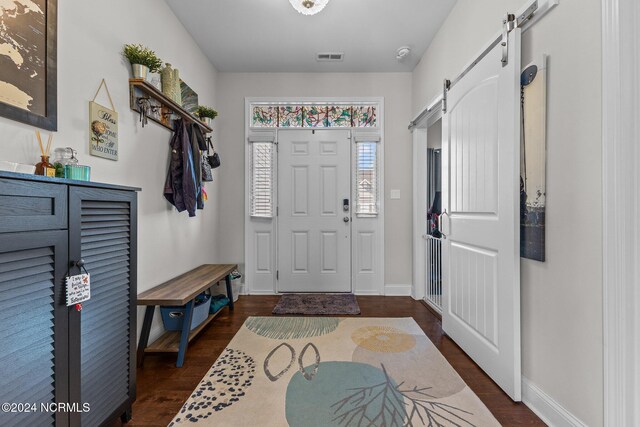 living room with hardwood / wood-style flooring and ceiling fan with notable chandelier