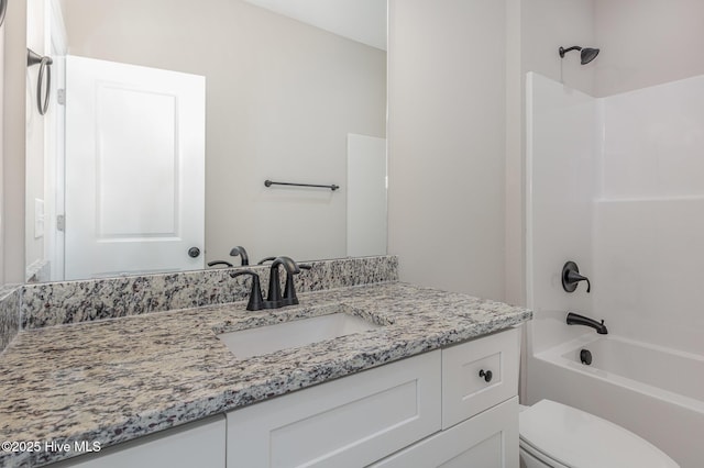 full bathroom with vanity, shower / washtub combination, and toilet