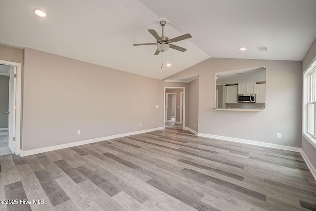 unfurnished living room with recessed lighting, vaulted ceiling, visible vents, and a ceiling fan