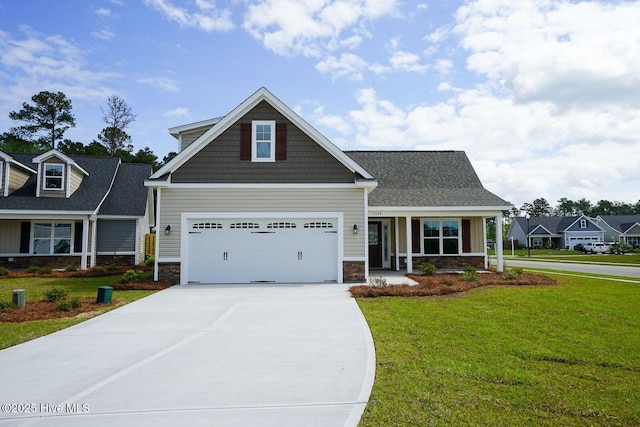 craftsman inspired home with stone siding, driveway, a front yard, and a garage