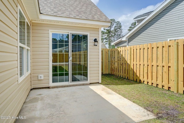 view of patio featuring fence