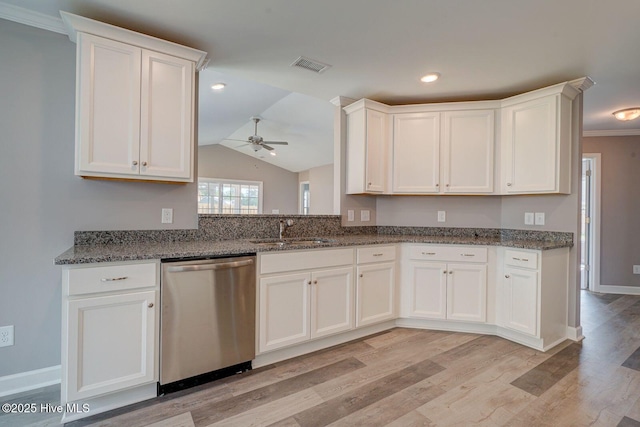 kitchen featuring stainless steel dishwasher, a sink, visible vents, white cabinetry, and a ceiling fan
