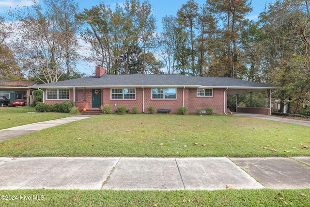 single story home featuring a carport and a front lawn