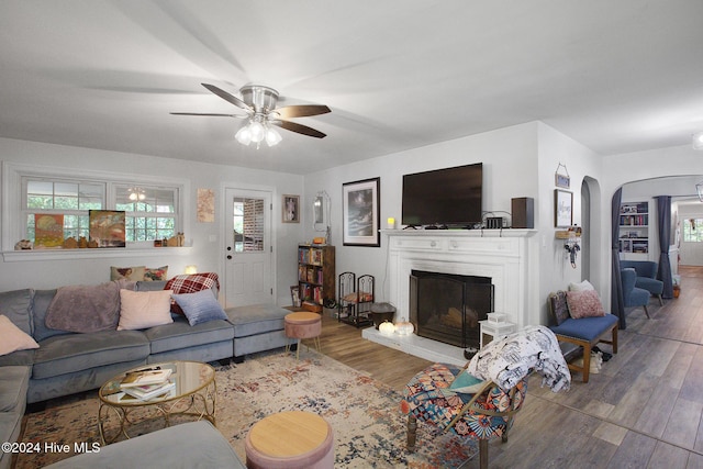 living room with hardwood / wood-style floors and ceiling fan