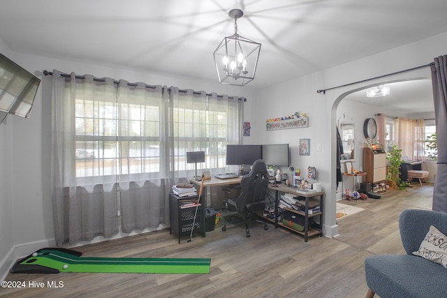 office area featuring hardwood / wood-style flooring and a notable chandelier