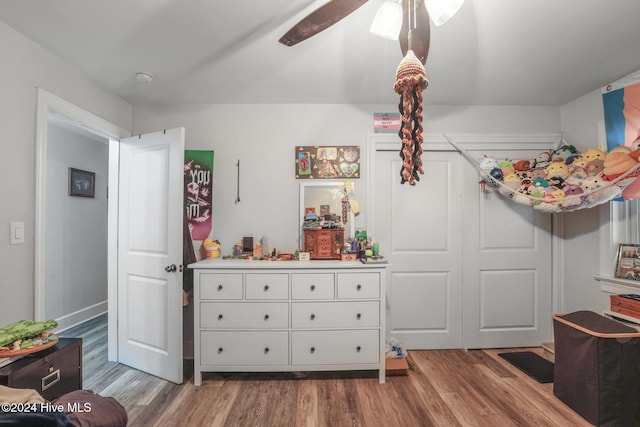 bedroom with hardwood / wood-style flooring and ceiling fan