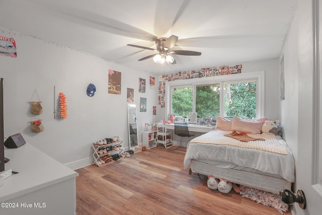 bedroom featuring light hardwood / wood-style flooring and ceiling fan